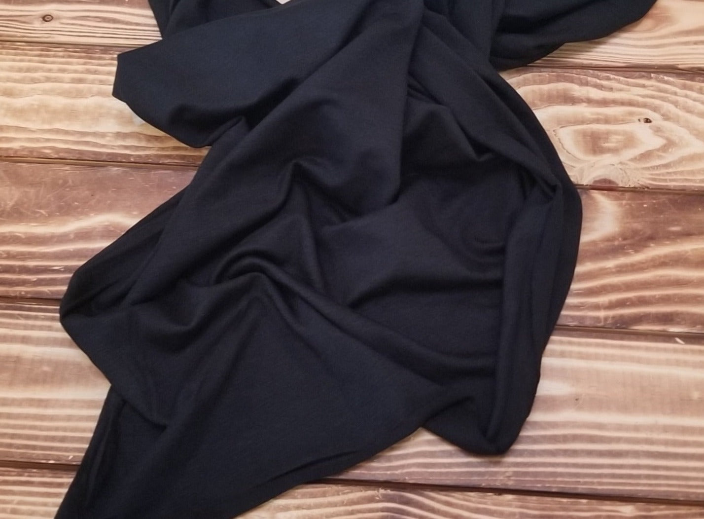 End of bolt: 2.5 yards of Designer Deadstock Rayon Wool Slub Stretch Jersey Black 5.5oz Knit-remnant