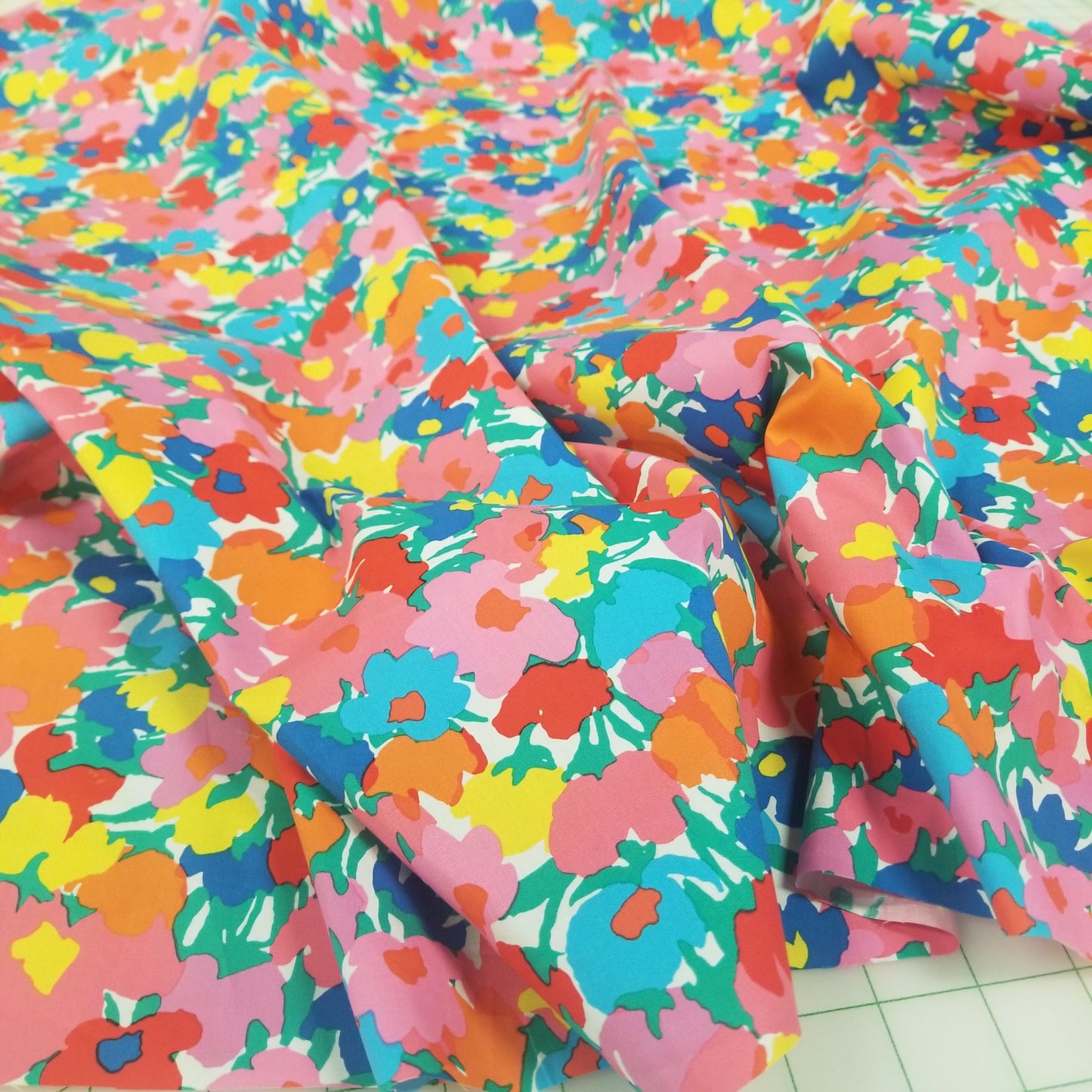 Colorful floral fabric on a tiled floor. LA Finch Fabrics. Southern Calif Fabric