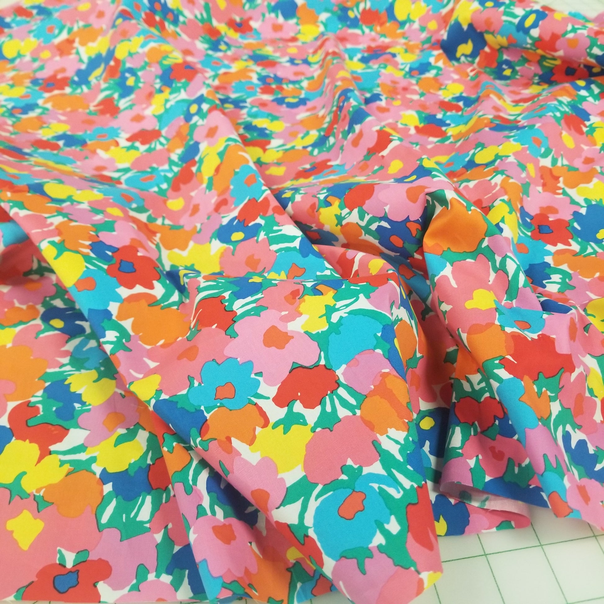 Colorful floral fabric on a tiled floor. LA Finch Fabrics. Southern Calif Fabric