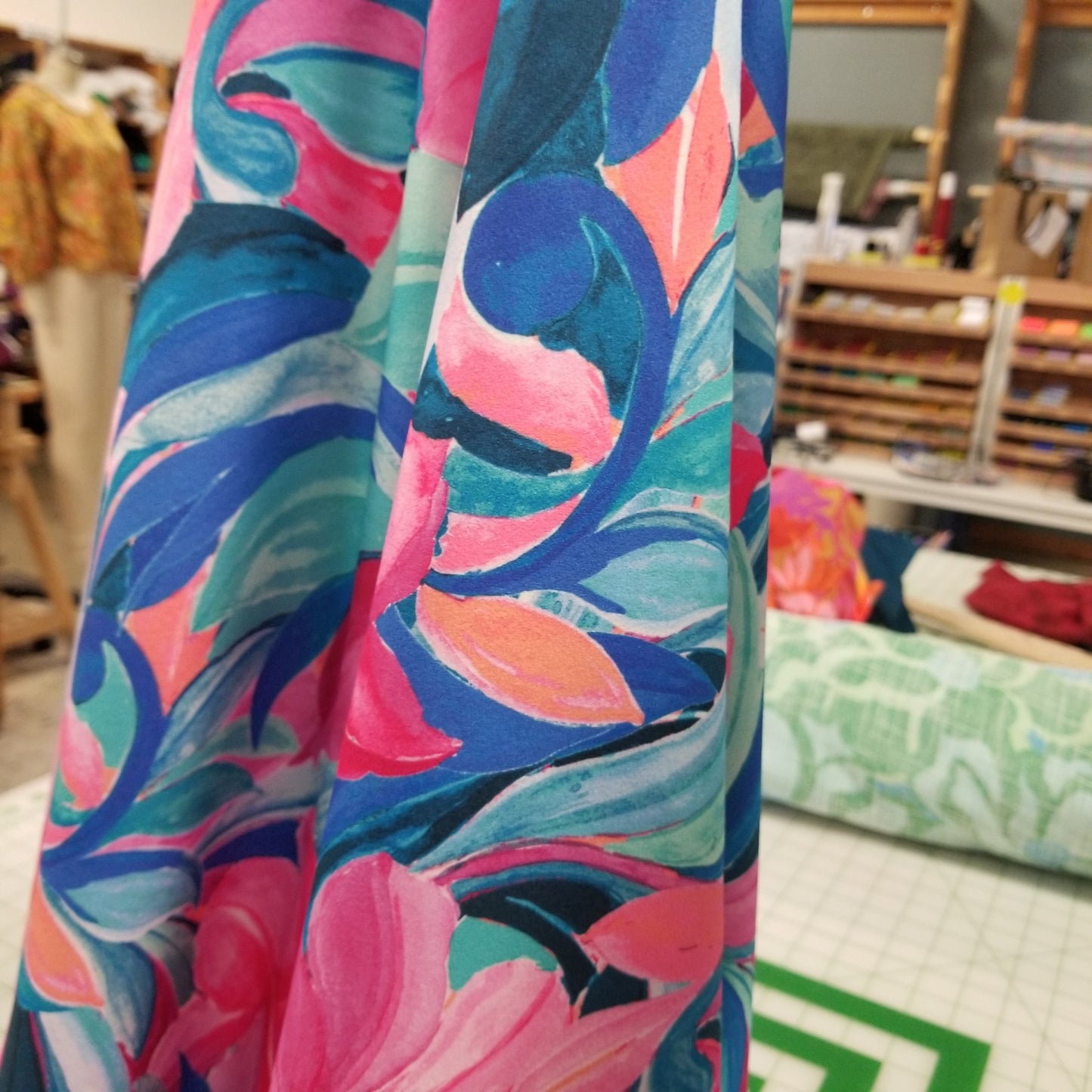 Colorful fabric with abstract pattern in a store setting