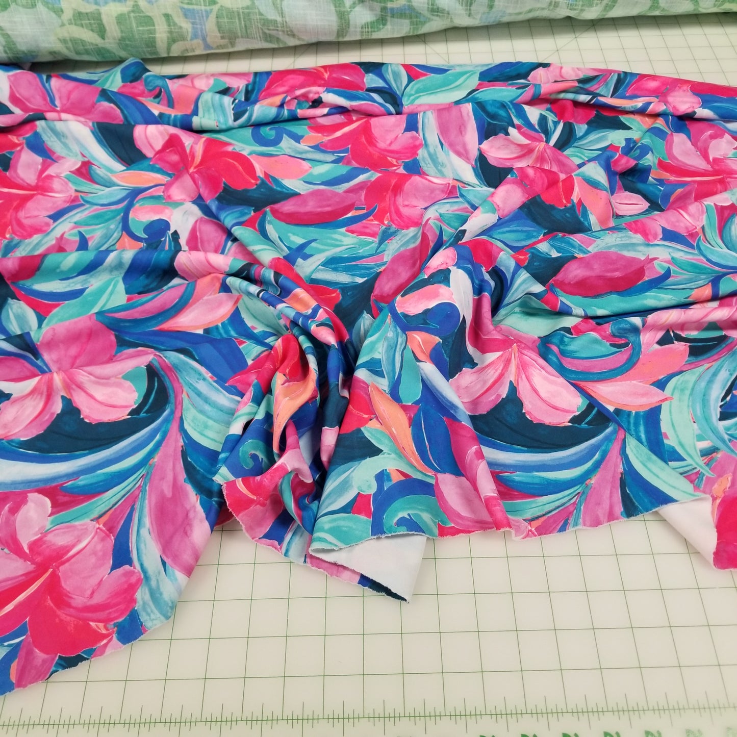 Colorful floral fabric on a grid background