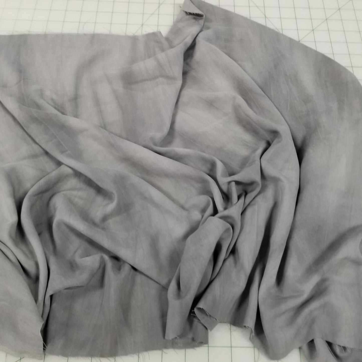 Gray fabric on a grid background