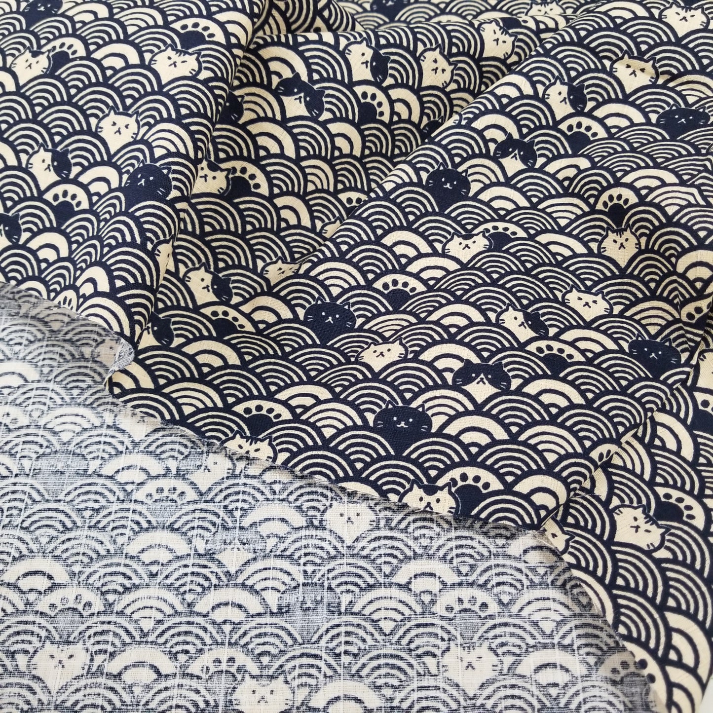 Three fabric swatches with different patterns: abstract wave design, floral pattern, and geometric pattern.