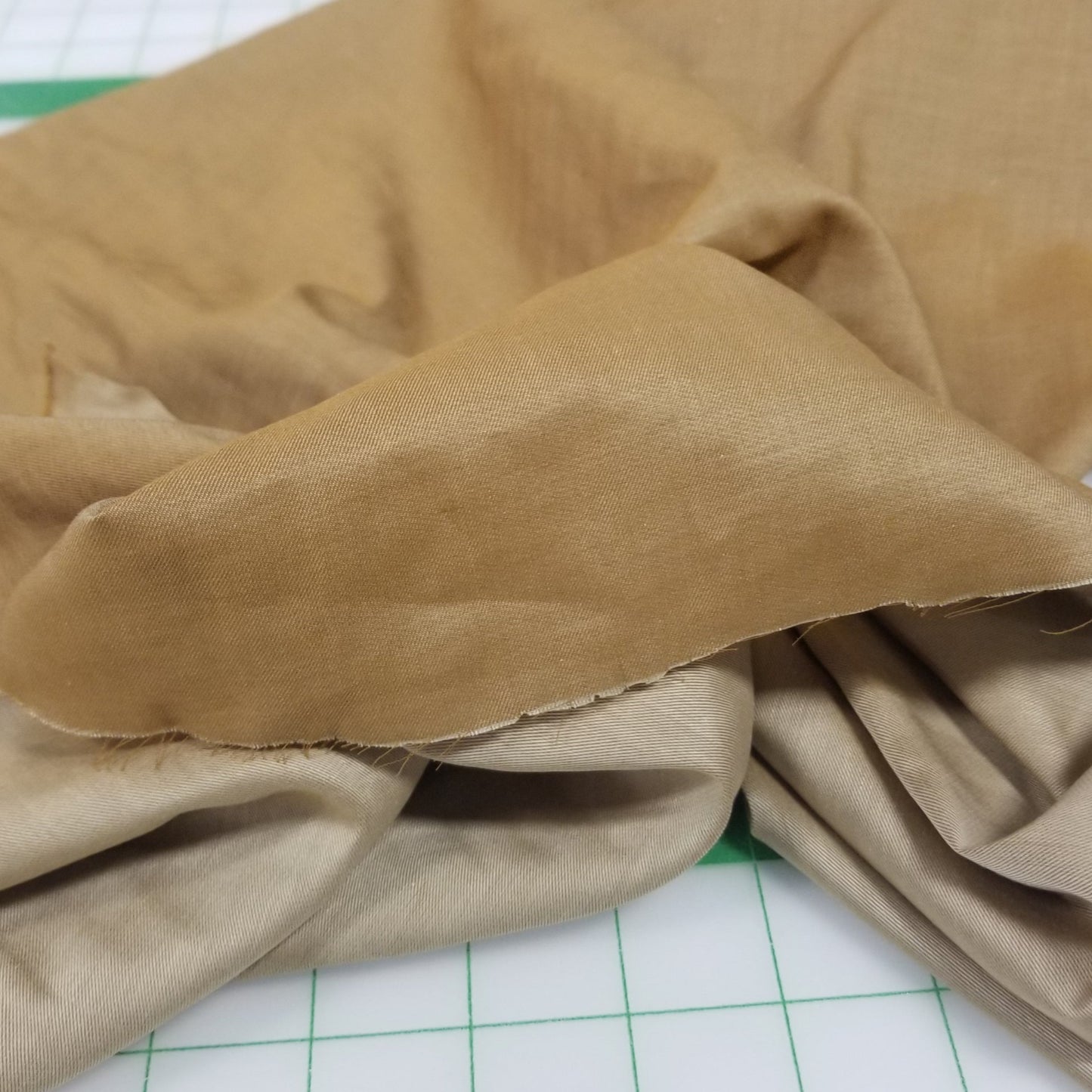 Brown fabric on a white surface with grid lines