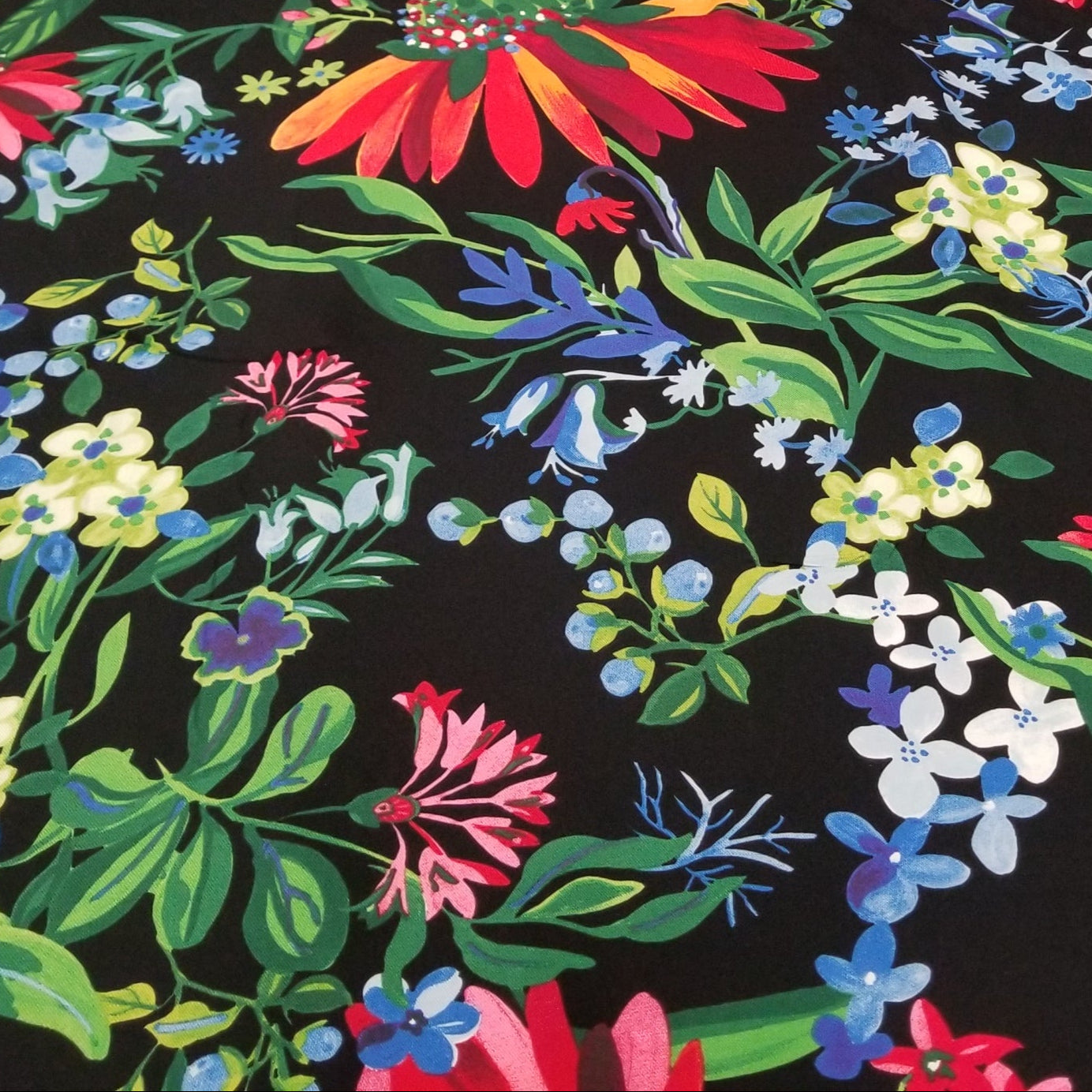 Floral fabric with colorful flowers on a black background
