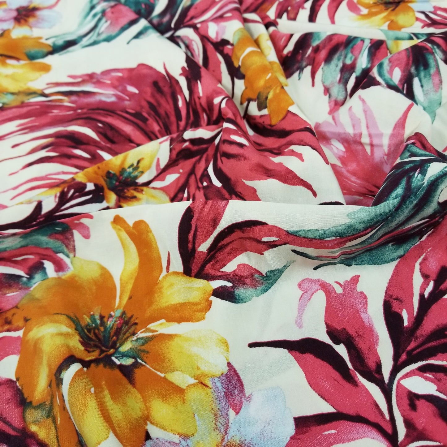 Close-up of fabric with vibrant tropical floral pattern