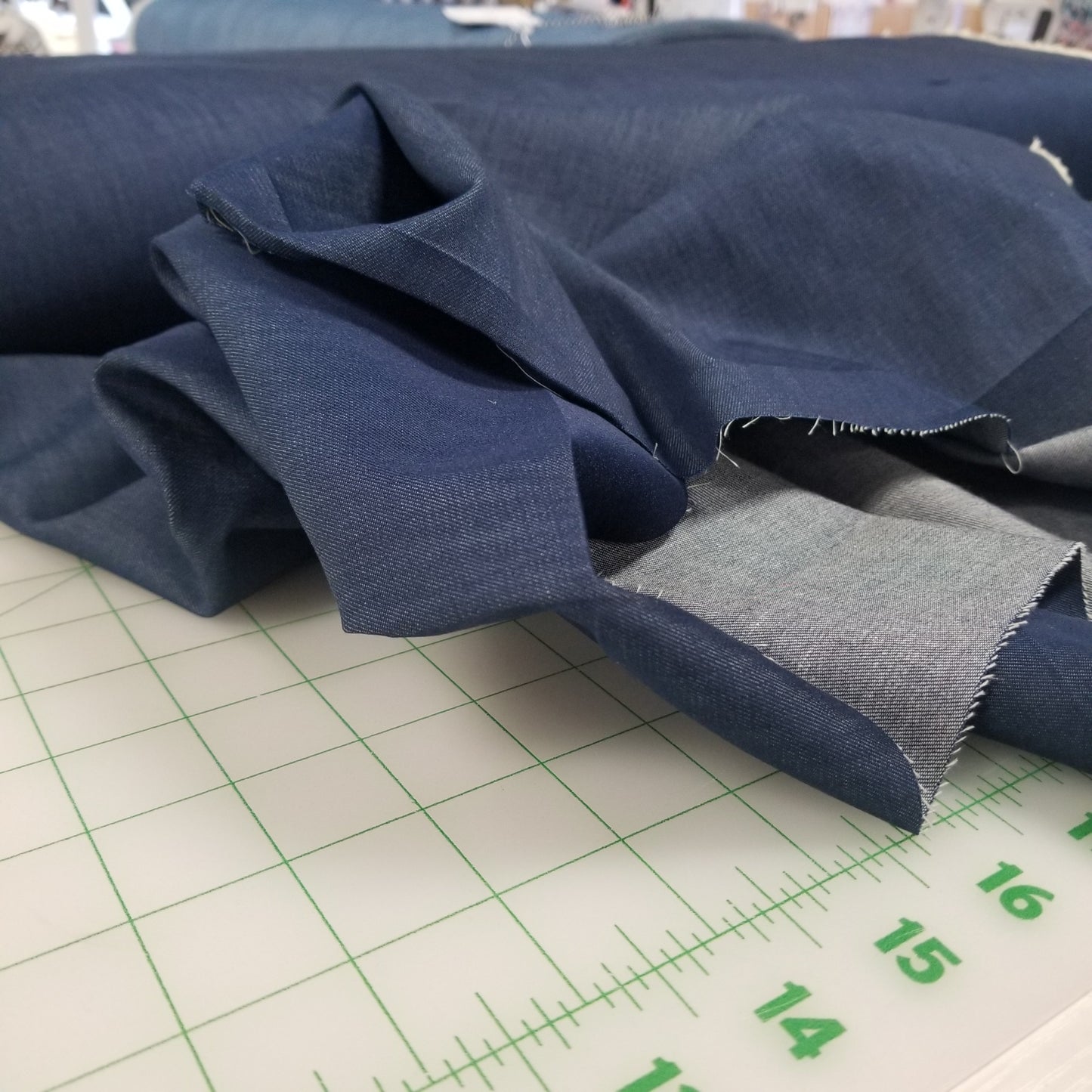 Blue fabric on a cutting mat with measurements