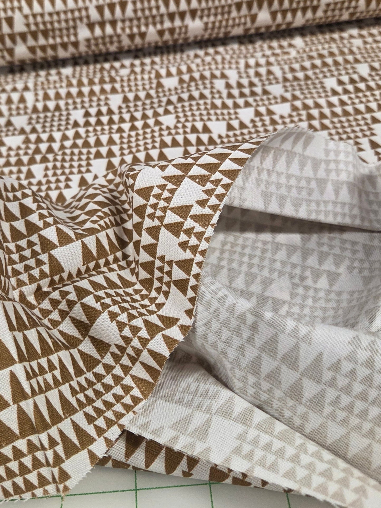 Fabric with geometric pattern on a cutting mat
