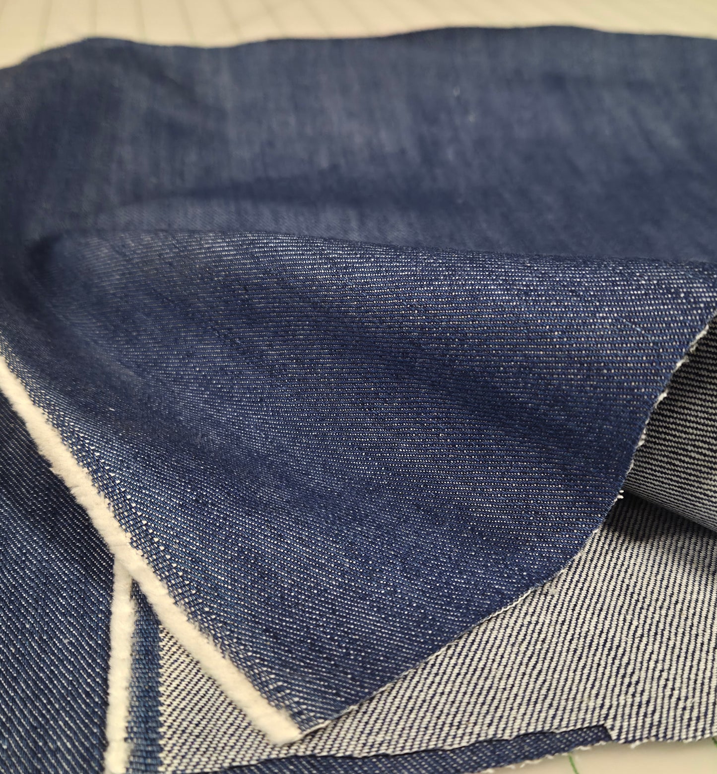 Close-up of blue denim fabric with a geometric pattern