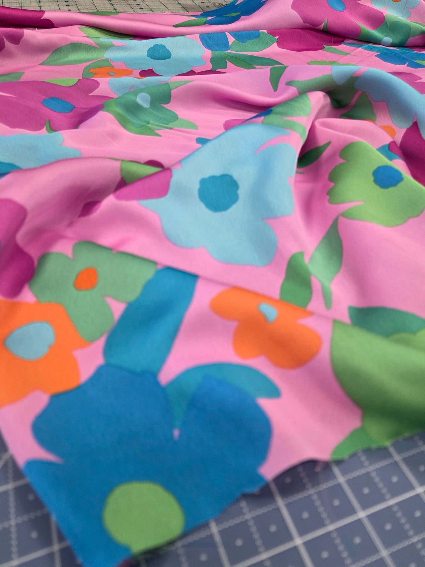 floral satin fabric for dresmaking. Floral retro look with vibrant colors of lilac , blue and pinks