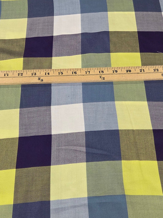 Plaid fabric with a measuring tape on a grid background