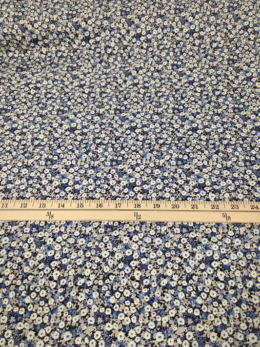 Floral patterned fabric with a ruler for scale on a white background. Kokka Fabric NCA-92770 cotton floral twill weave woven