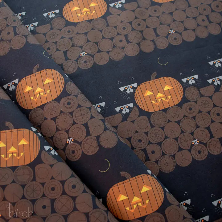 Halloween-themed fabric with pumpkins and cats on a dark background. La Finch Fabrics