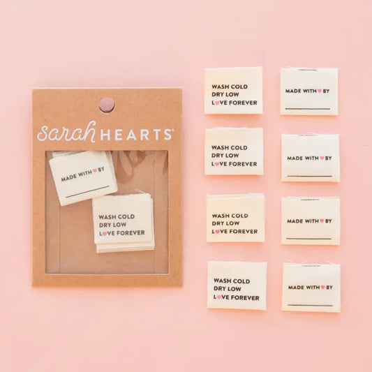 Packaged product with 'sarah Hearts' branding on a pink background