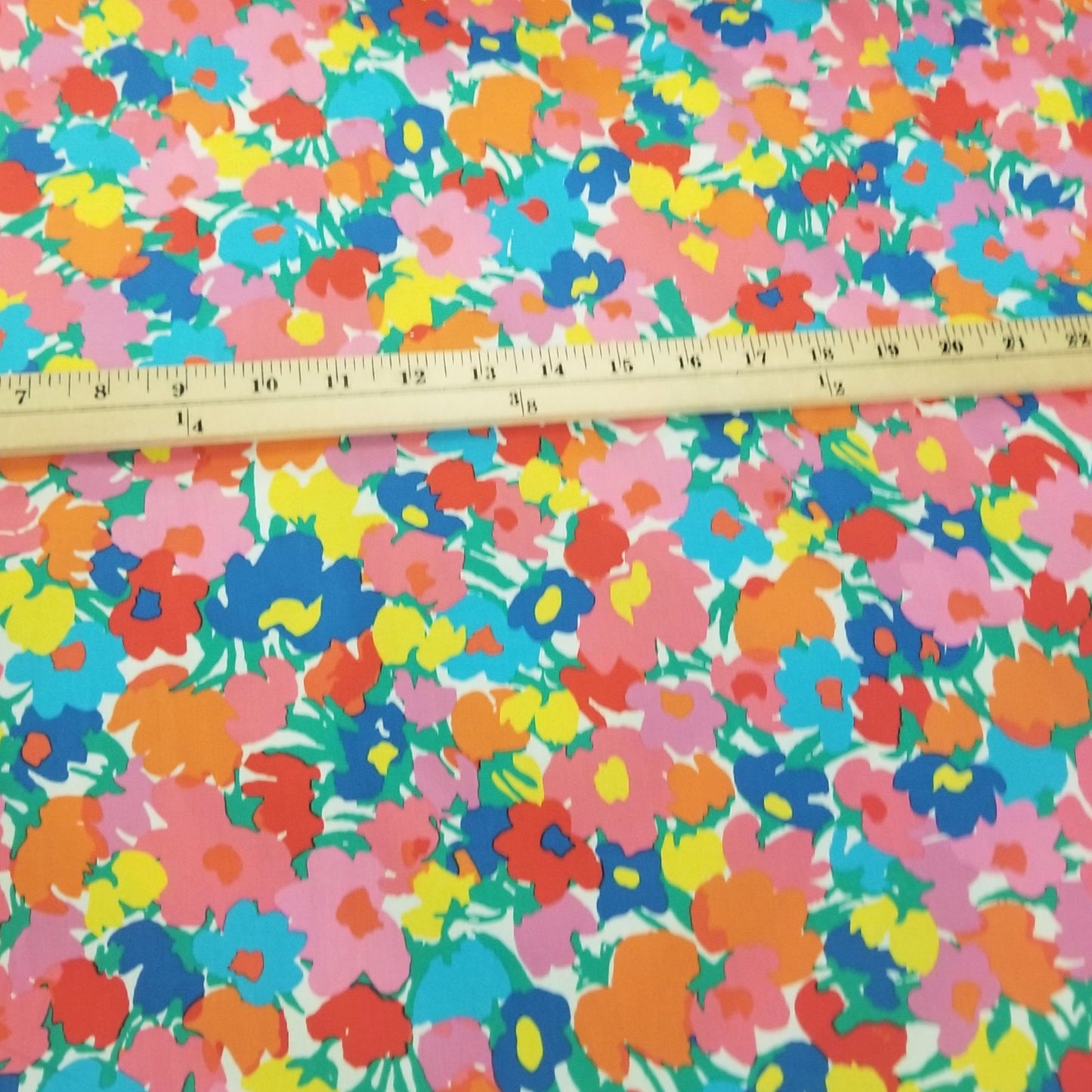 Colorful floral fabric with a ruler for scale