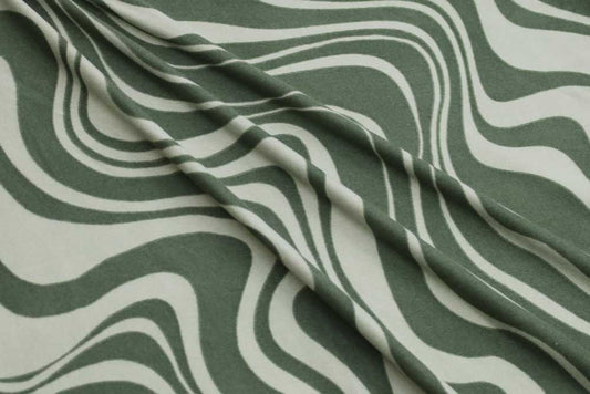 End of Bolt: 2 yards of  Retro Swirls Double Brushed Green Poly Spandex Knit- Remnant