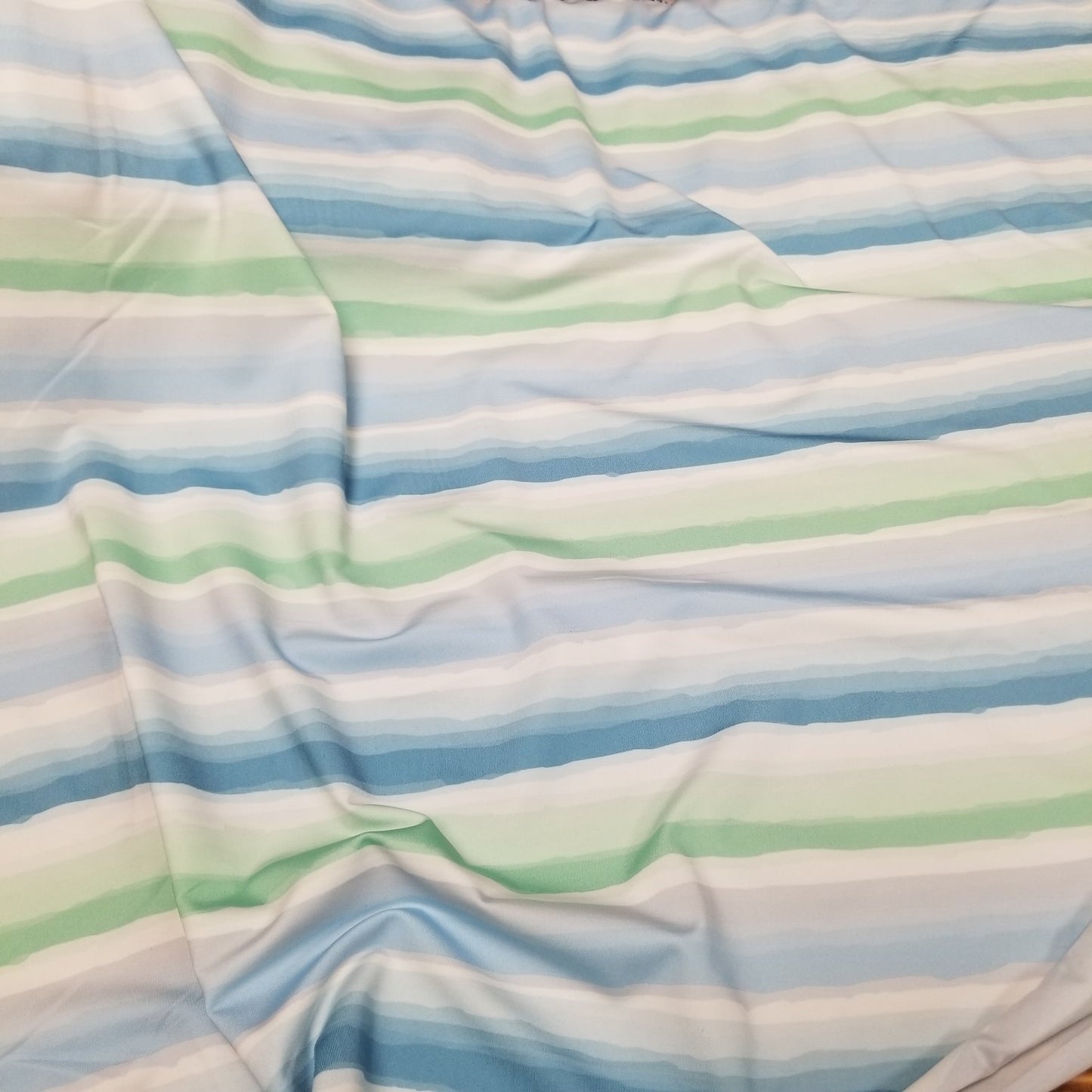 End of Bolt: 2-3/4th yards of Nylon Spandex Swirly Watercolor Stripes Swim/Activewear Knit-Remnant