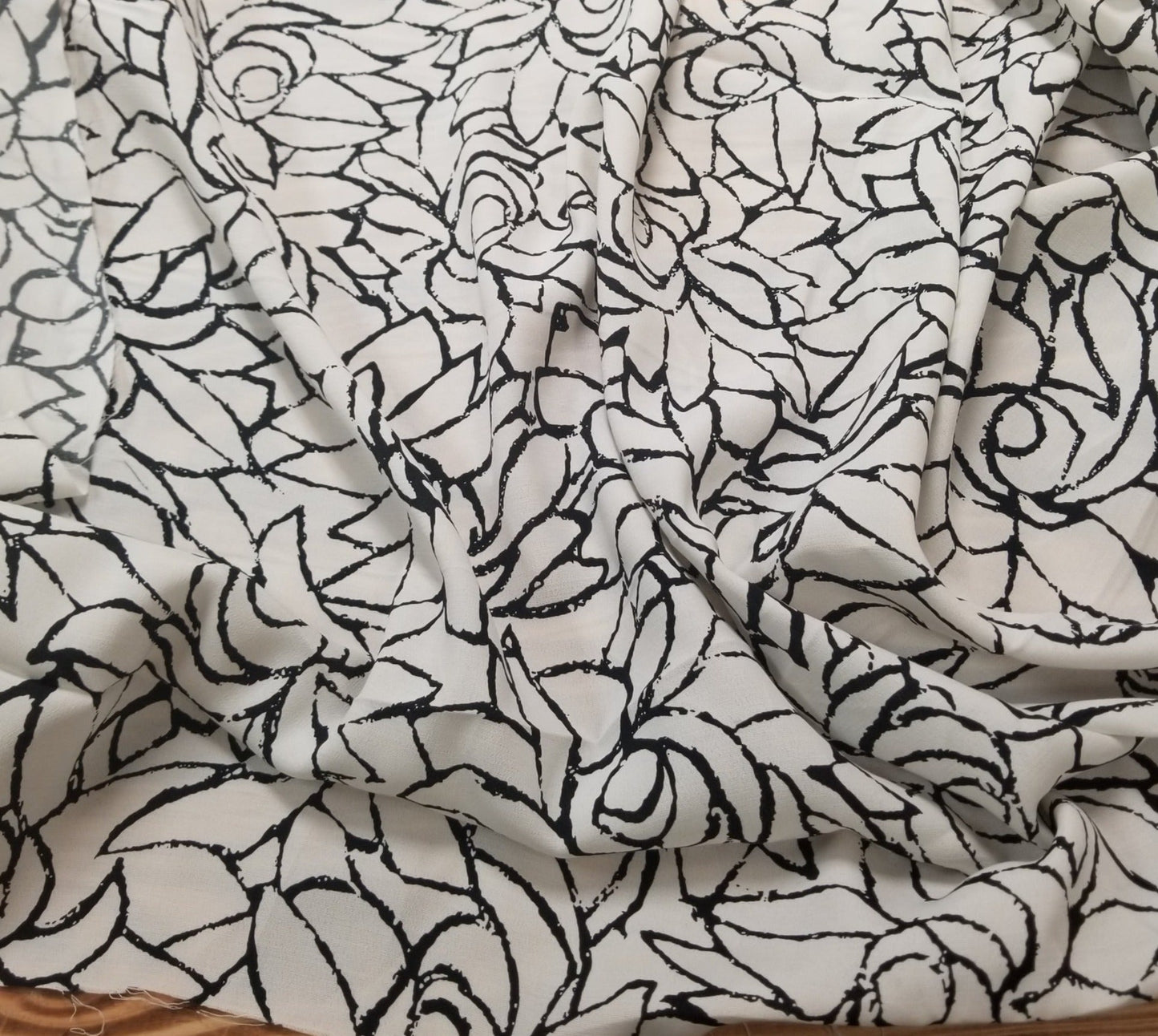Designer Deadstock Ivory and Black Scattered Roses Rayon Woven- sold by the yard
