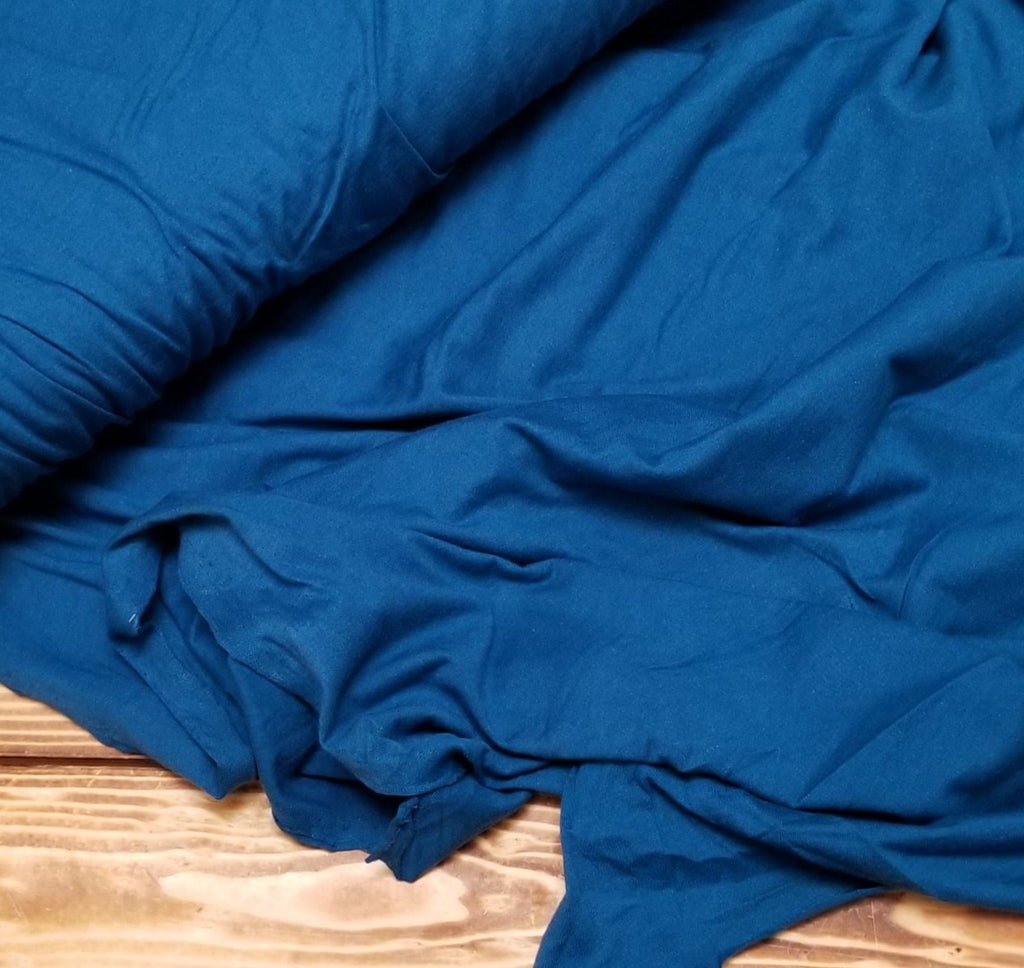 cotton jersey 100% knit teal fabric. slight stertch. great for tees. USA made knit