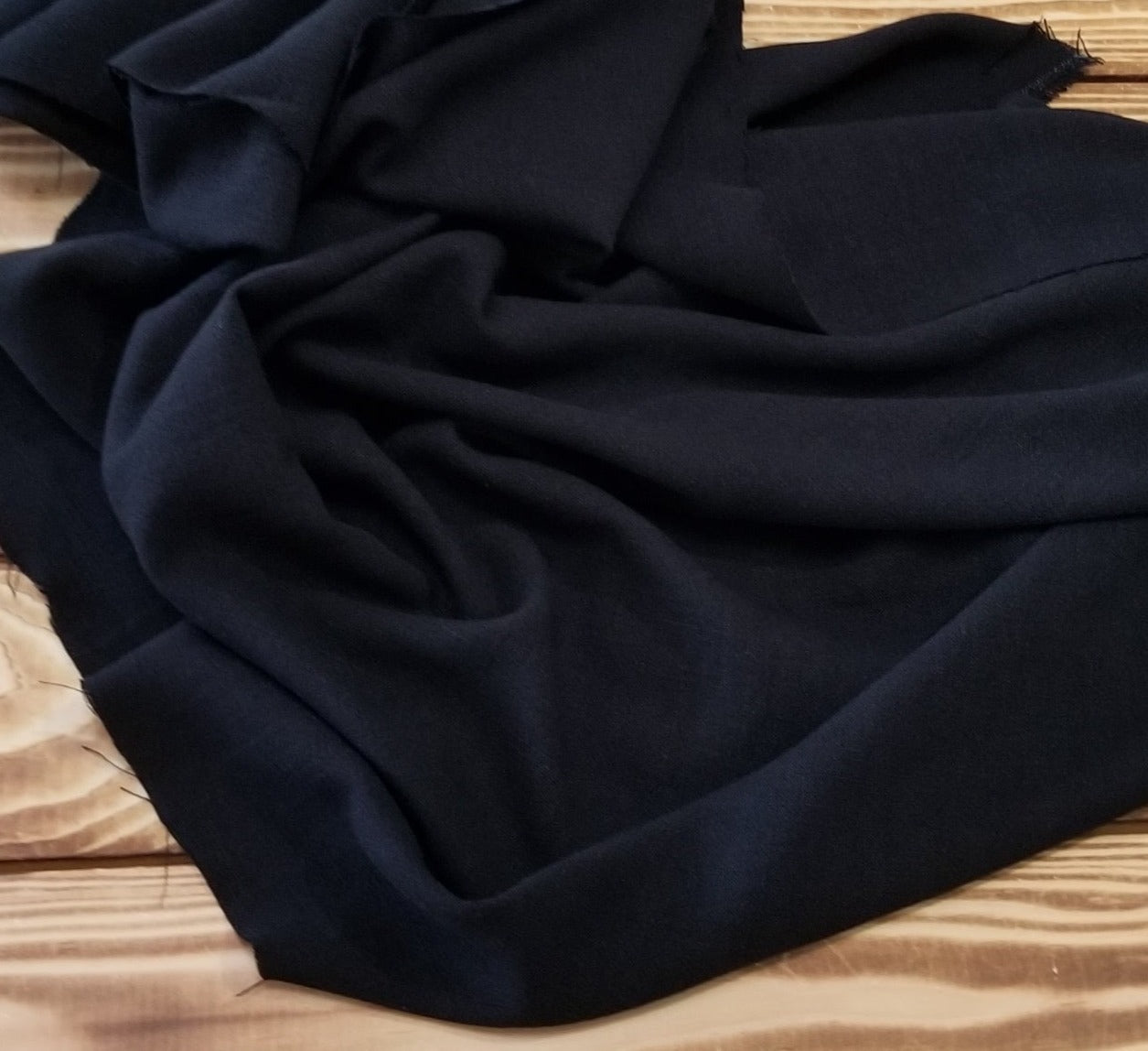 deadstock black textured opaque rayon linen. sold by the yard , retail . LA Finch Fabrics