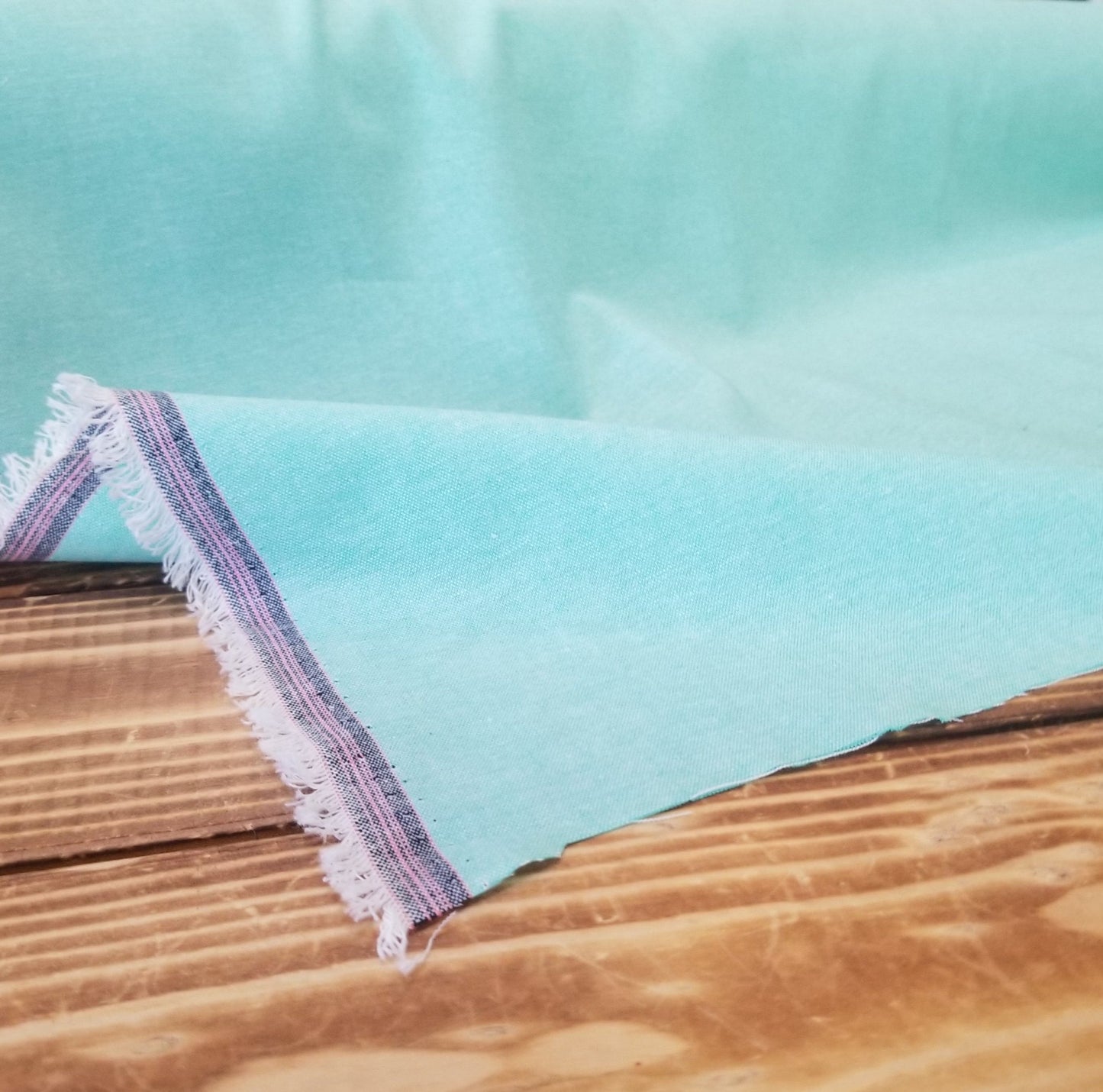 Designer Deadstock Aquamarine Green Cotton Chambray Woven with Pink Selvedge -by the yard