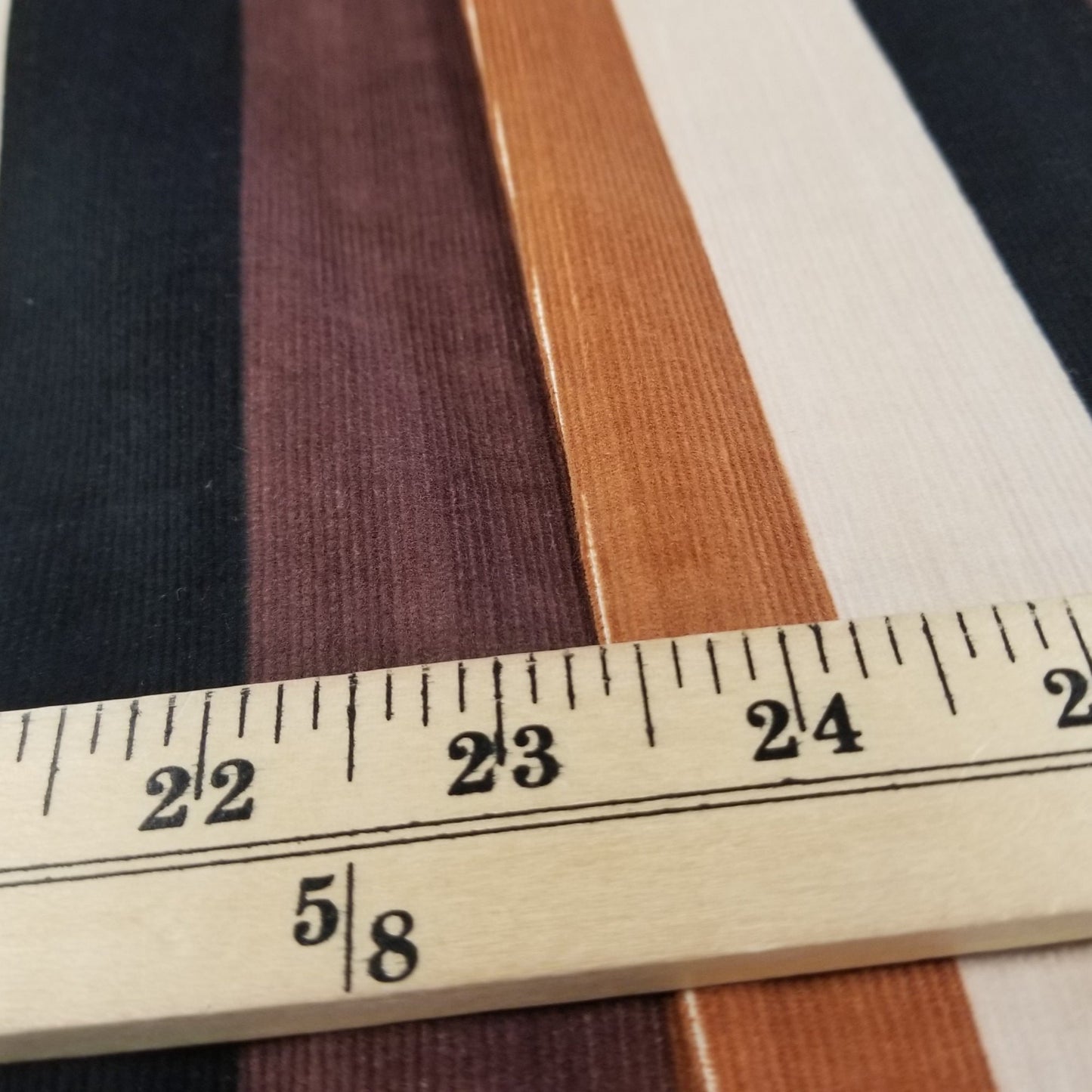 End of Bolt: 7/8th yard of Designer Deadstock Vertical Black and Brown Stripe Baby Wale Corduroy Woven- remnant