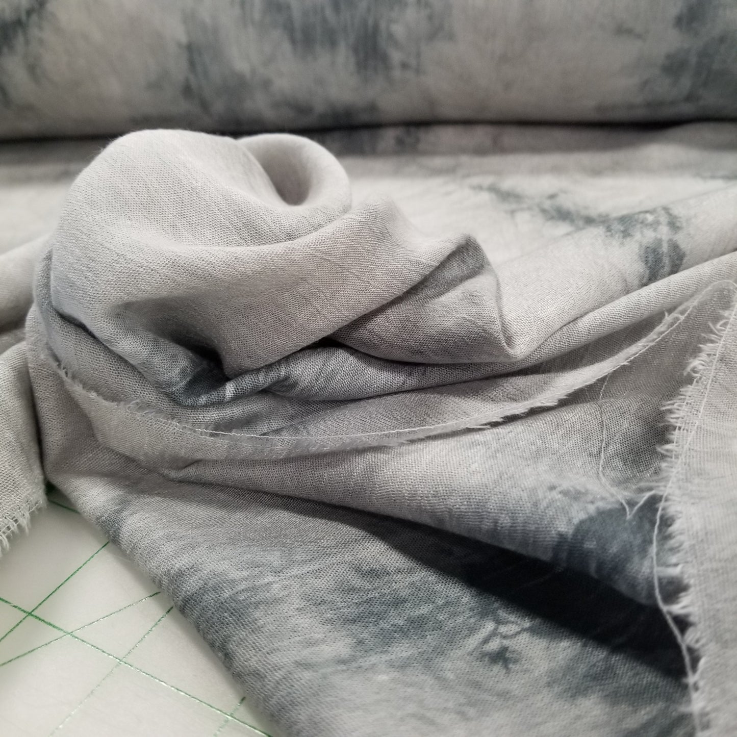 Close-up of gray fabric with a textured surface on a neutral background