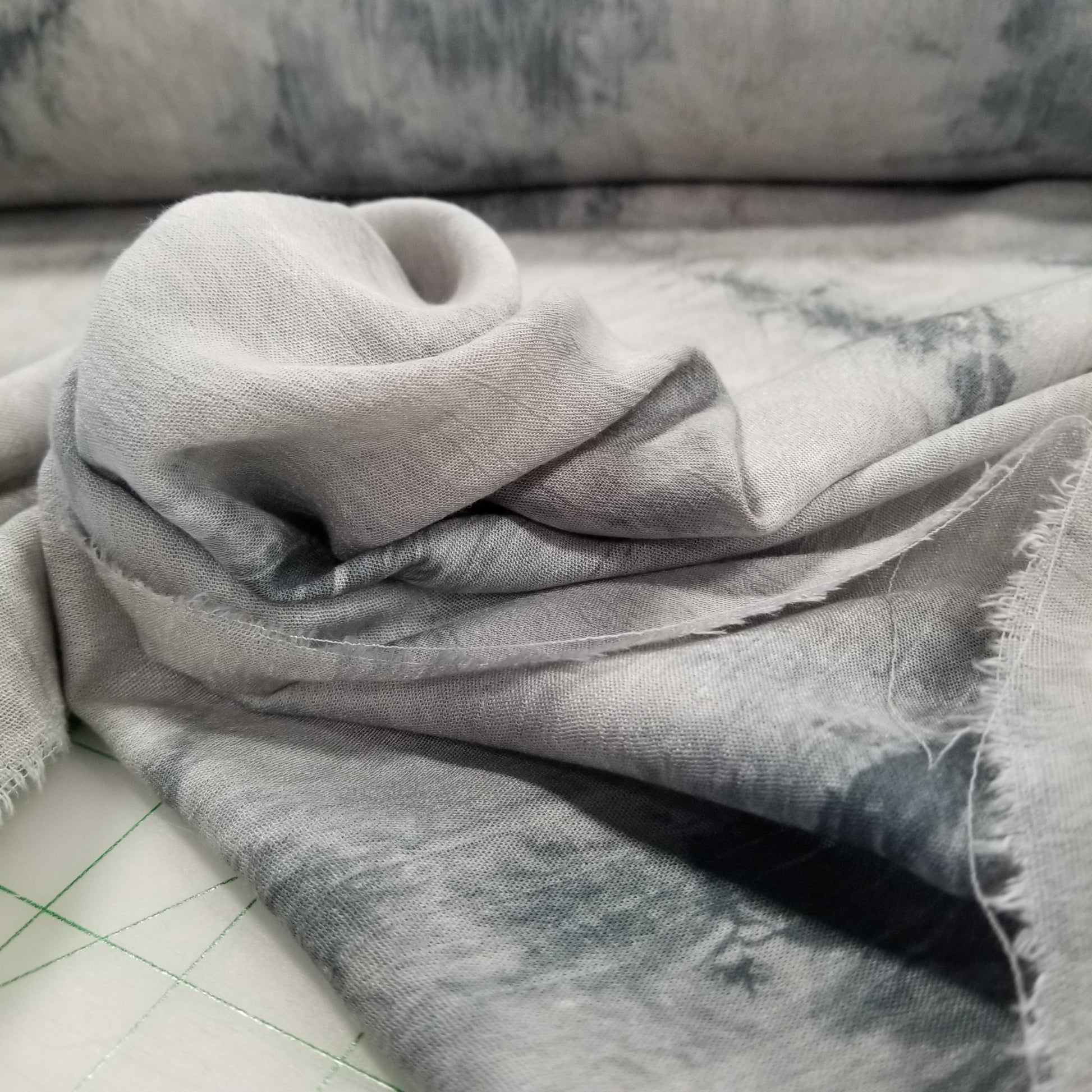 Close-up of gray fabric with a textured surface on a neutral background