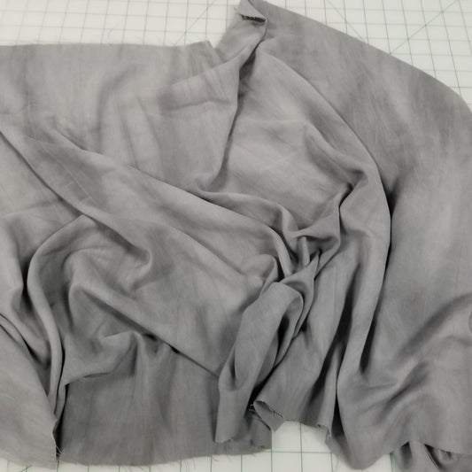 Gray fabric on a grid background