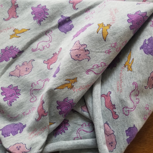 Gray fabric with colorful dinosaur patterns