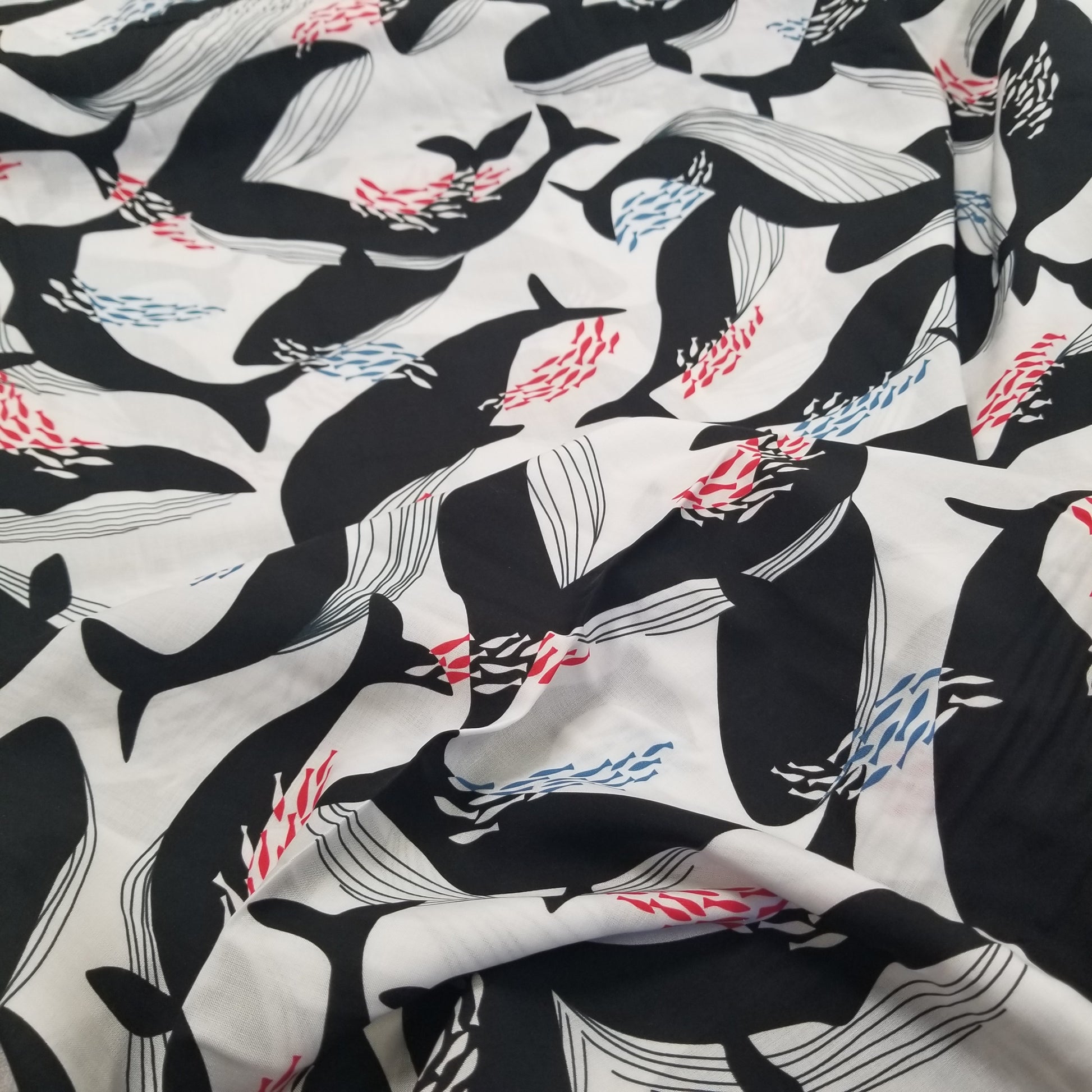 Fabric with black and white whale pattern