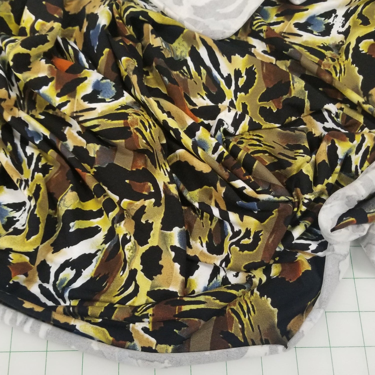 Fabric with a tiger print on a grid background