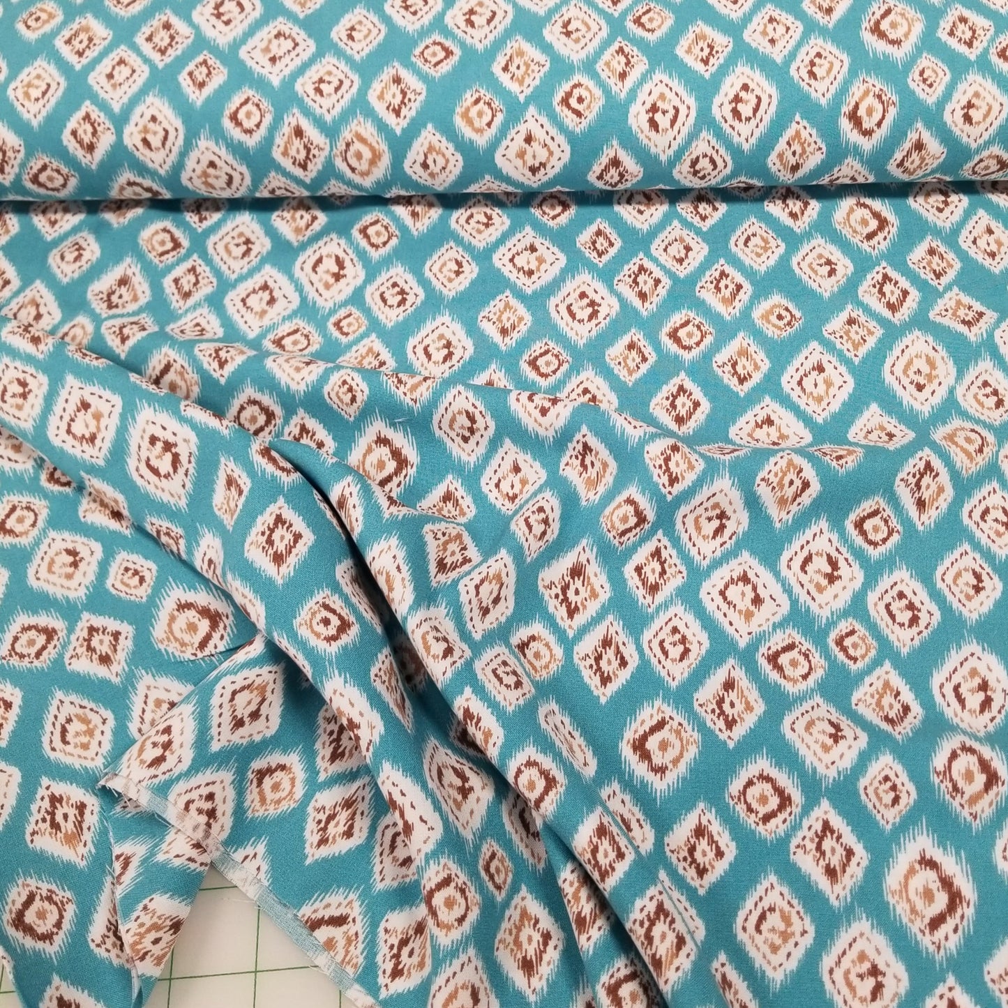 Fabric with a diamond pattern on a blue background
