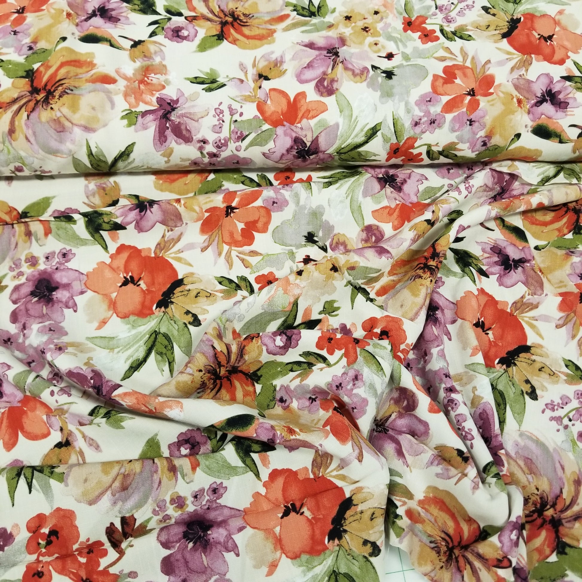 Floral fabric with colorful flowers and leaves on a white background