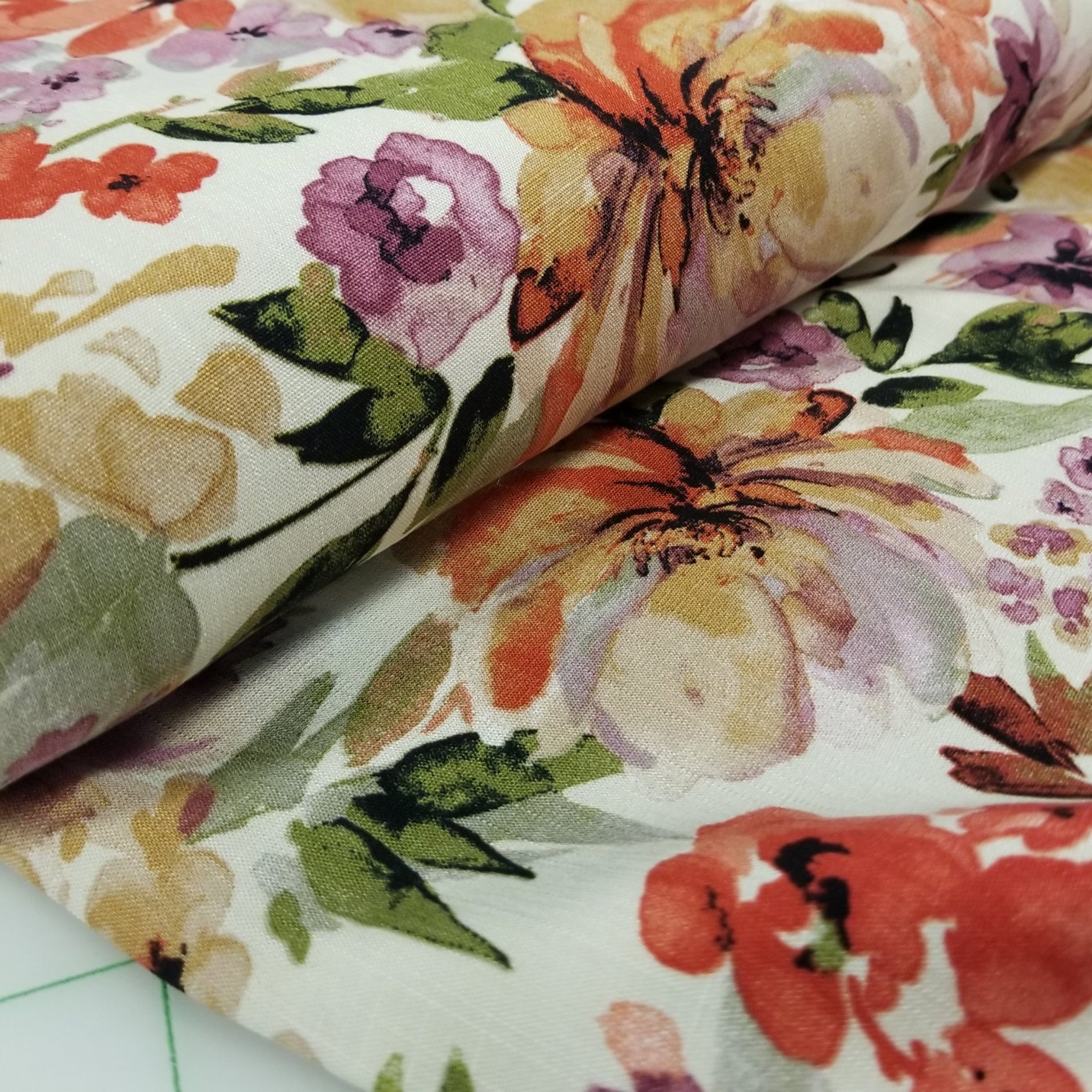 Close-up of a floral fabric with colorful flowers on a white background
