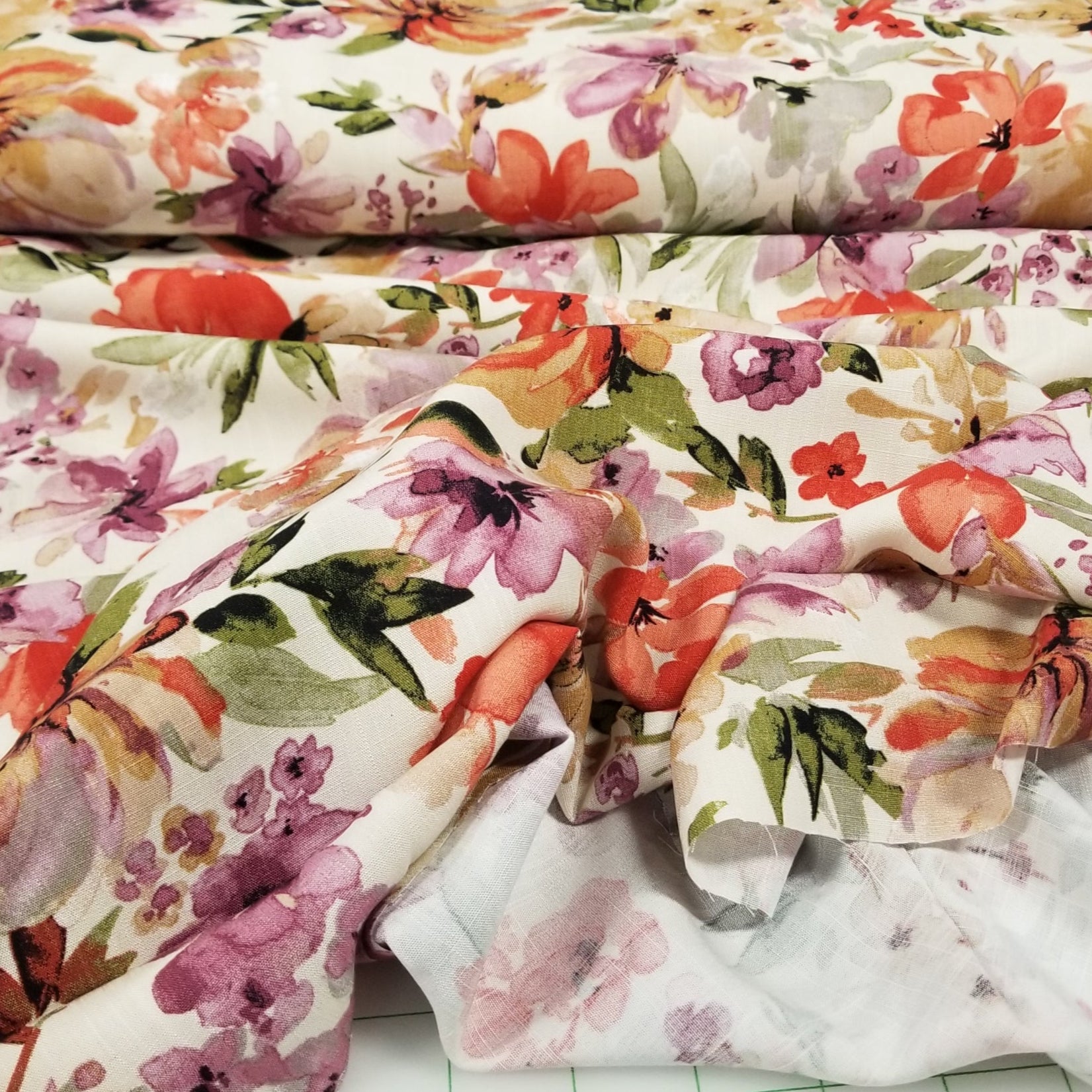 Floral fabric swatches on a grid background