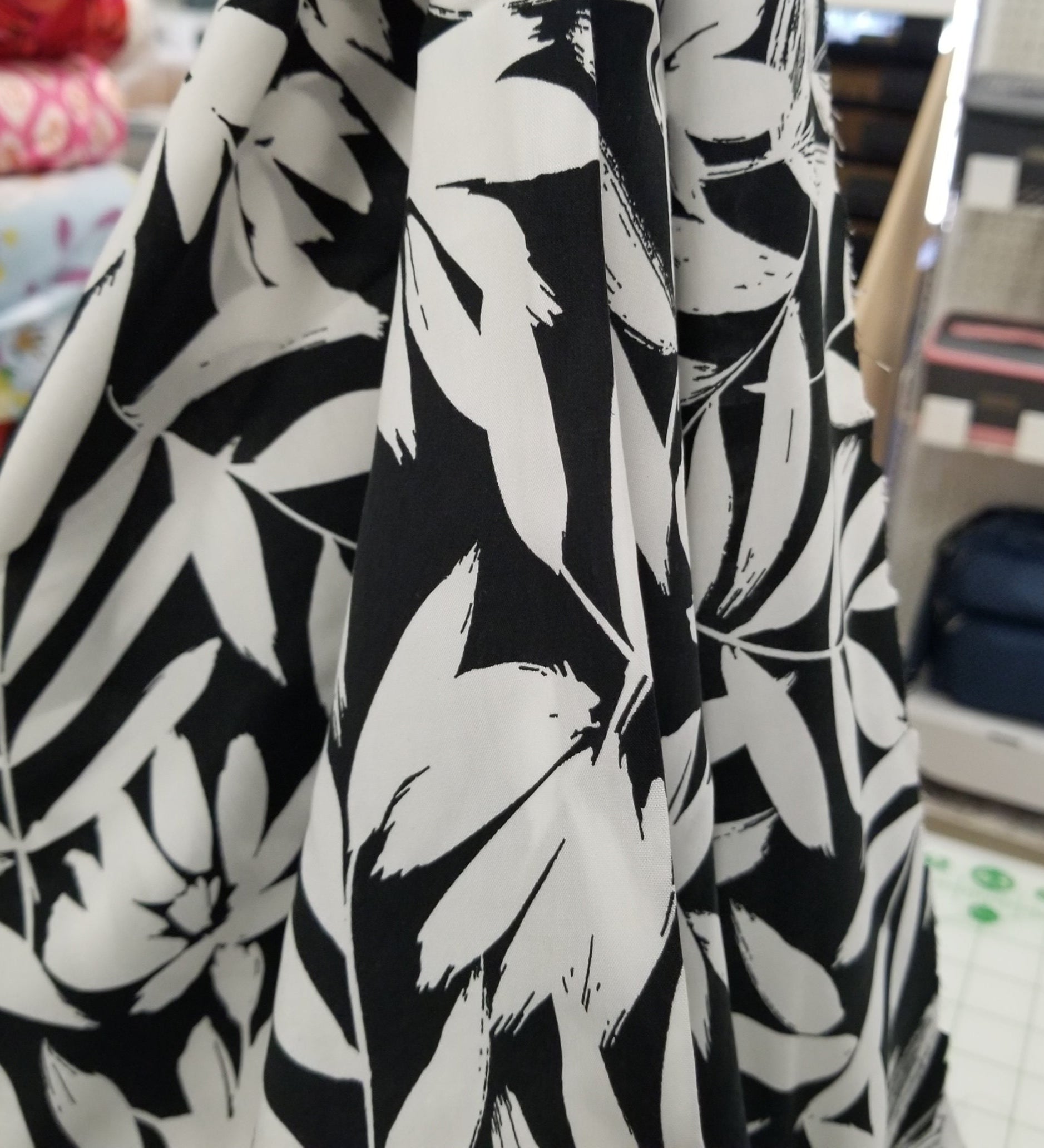 Black and white floral patterned fabric with a blurred background