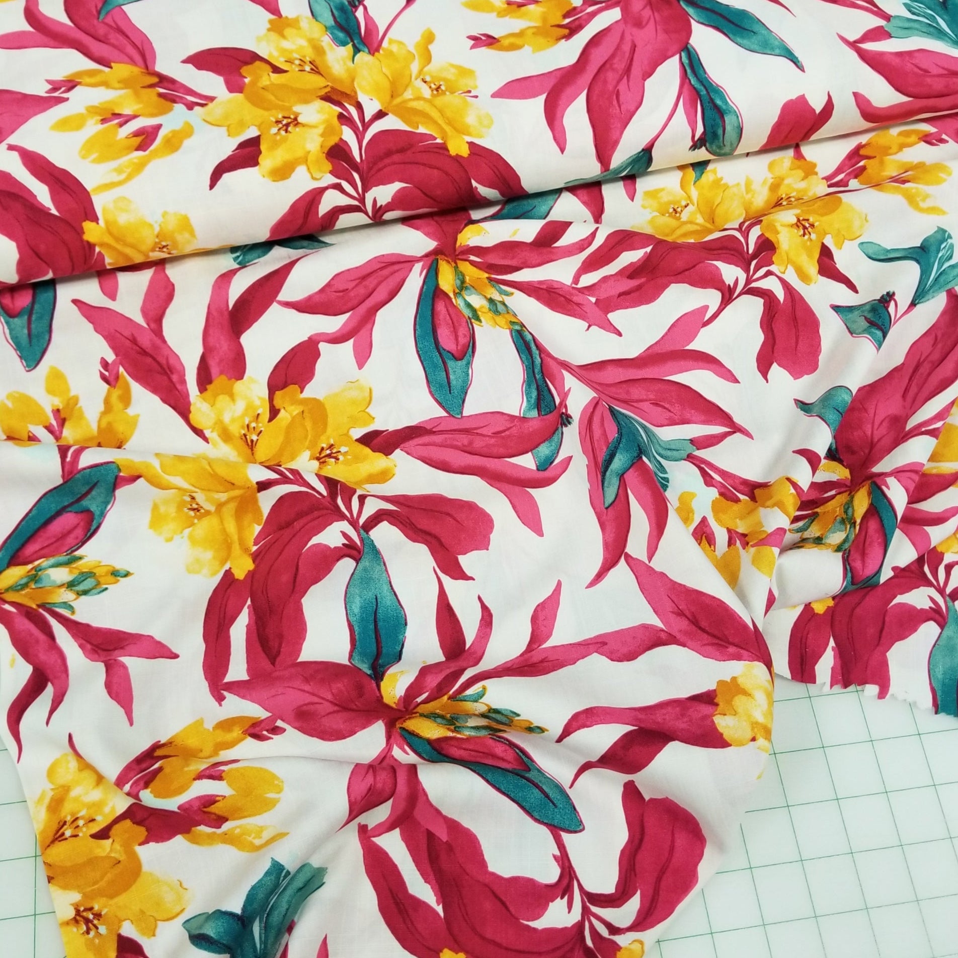 Colorful floral fabric on a grid background