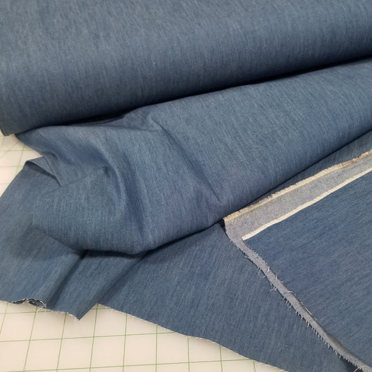 Blue fabric on a cutting mat with measurements