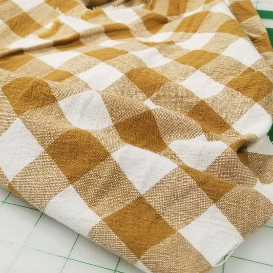 Checkered fabric with brown and white pattern on a grid background