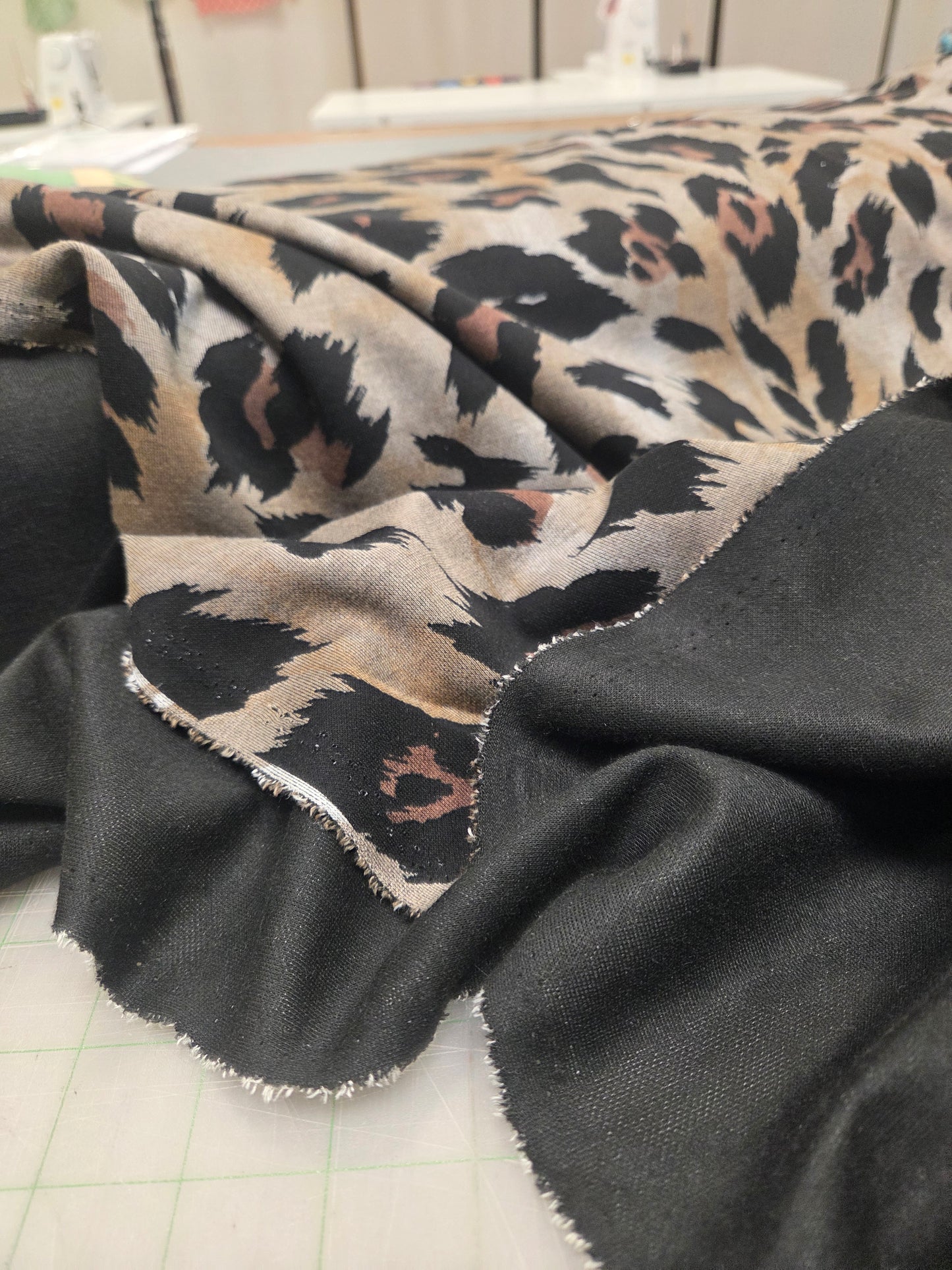 Close-up of a leopard print fabric with a black border.