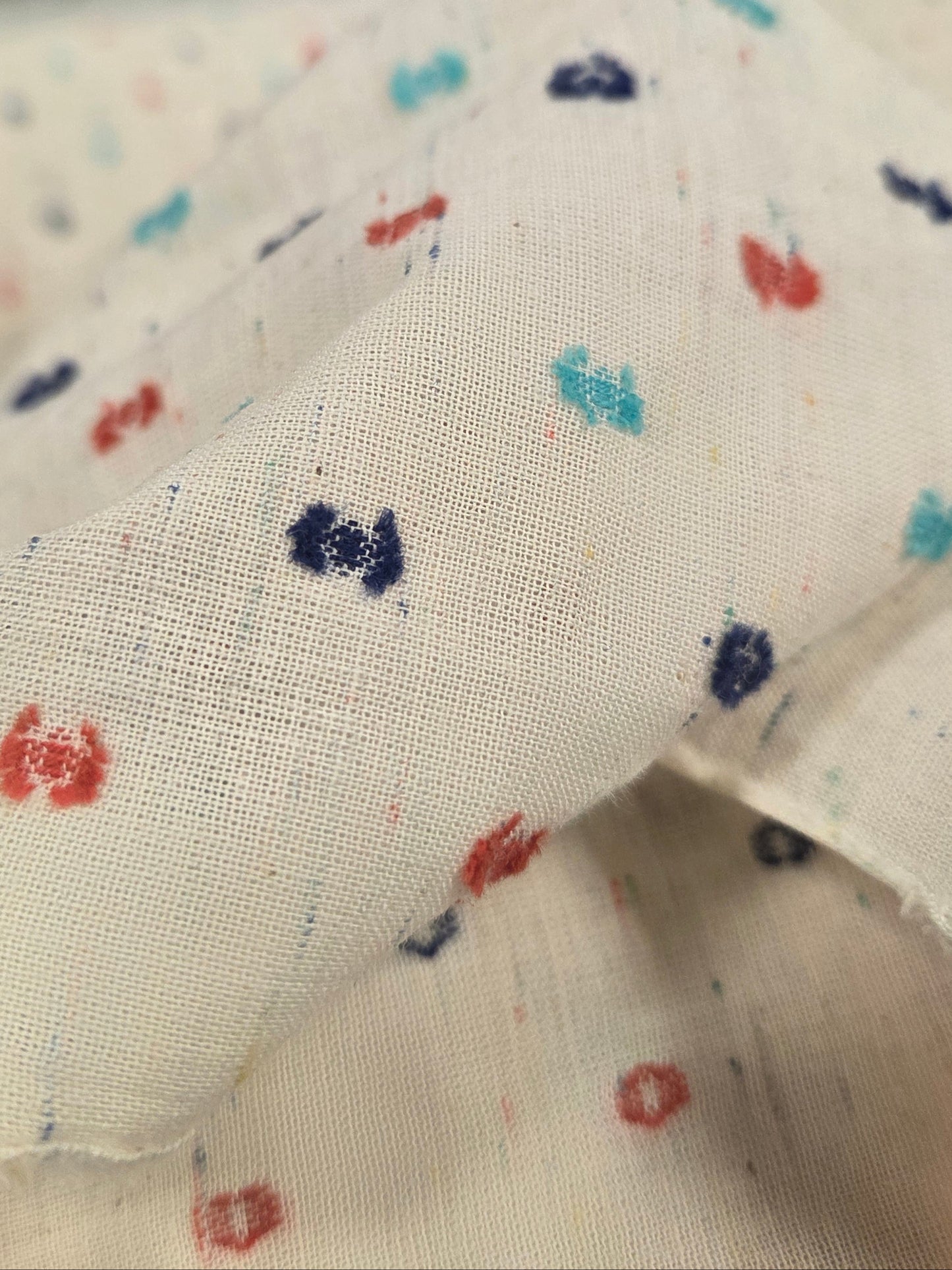LA Designer Deadstock Cream Speckled Cotton Swiss Dot Navy, Orange, and Turquoise Woven- by the yard