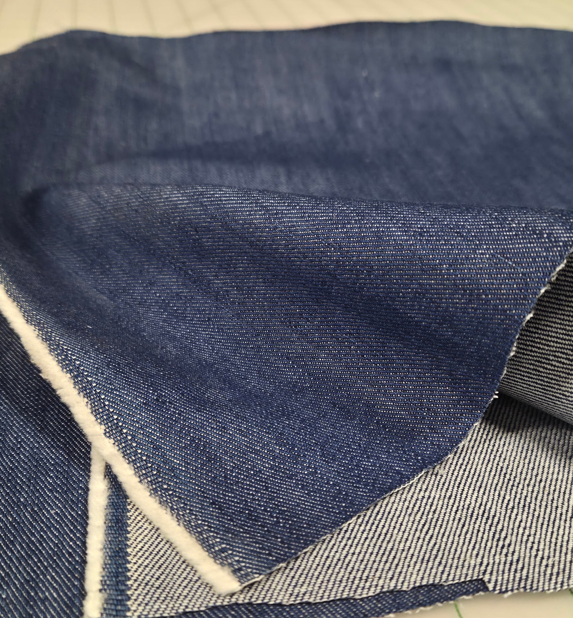 Close-up of blue denim fabric with a geometric pattern