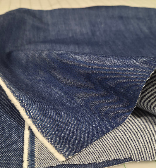 Close-up of blue denim fabric with a geometric pattern