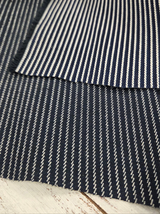 Close-up of a black and white striped fabric texture.