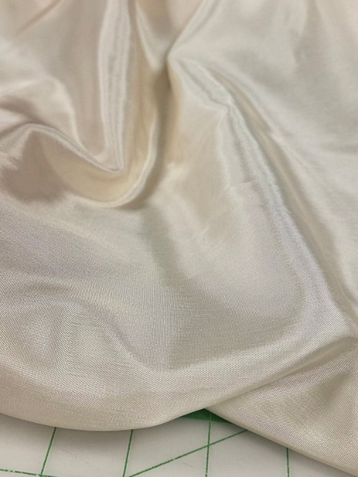Designer Deadstock Faint Yellow Cream Hue Solid Polyester Lining Woven- by the yard