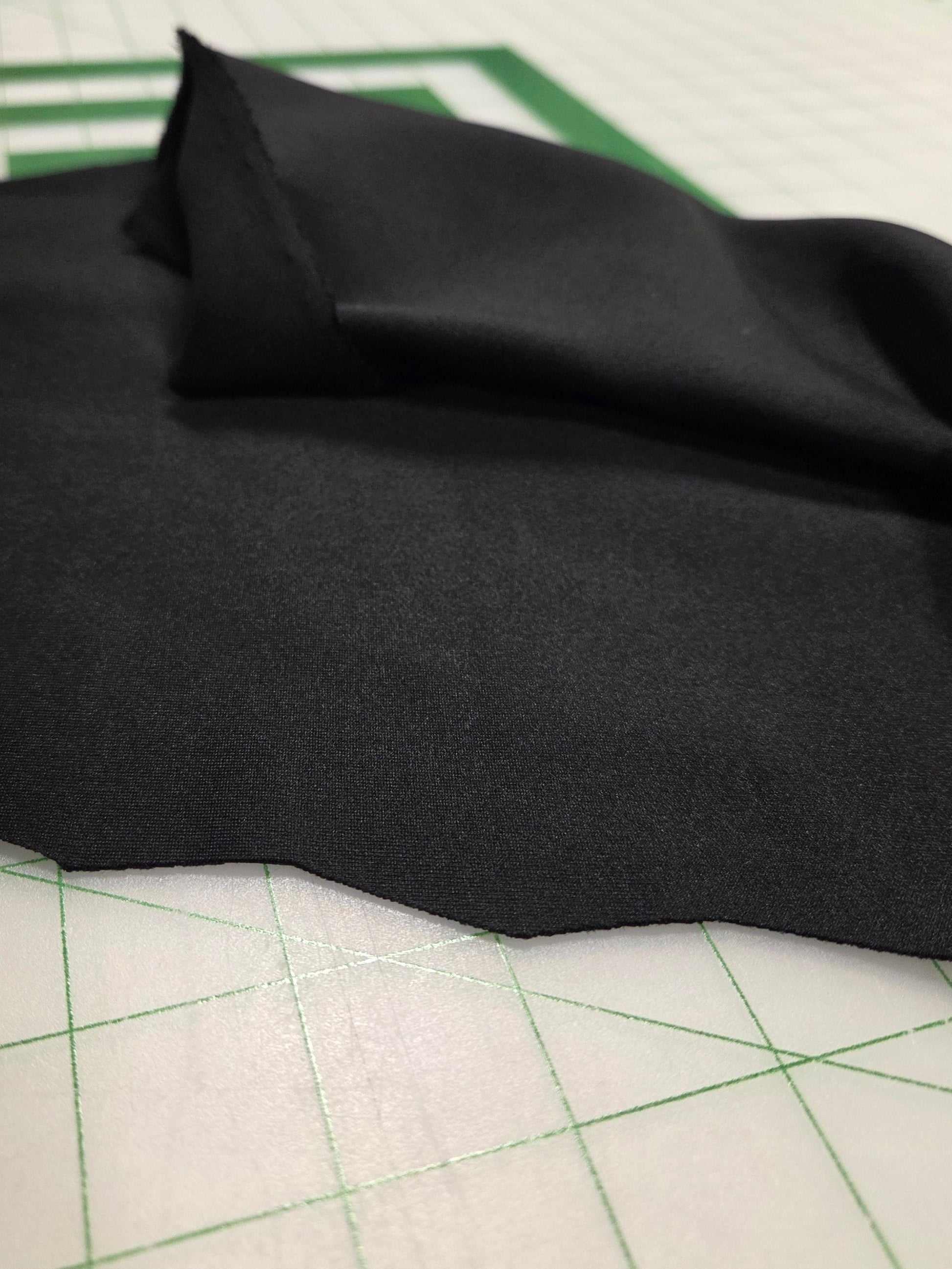 Tencel Modal Scuba is a luxurious, sustainable fabric blending super-soft, wood-derived Tencel Modal with polyester and spandex for structure, offering exceptional drape, breathability, moisture-wicking, and wrinkle resistance, ideal for comfortable yet stylish activewear, dresses, and everyday garments that feel silky and hold their shape