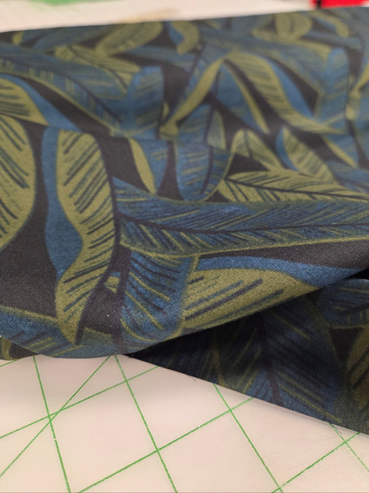 sevenberry fabrics cotton sheeting island look of leaves foliage blue, green and black