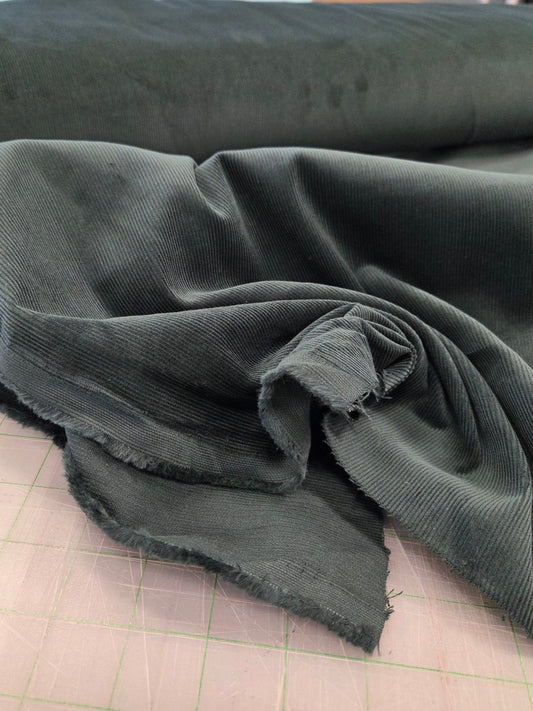 16 wale pine green corduroy cotton solid by the yard. LA Finch Fabrics for apparel fabrics