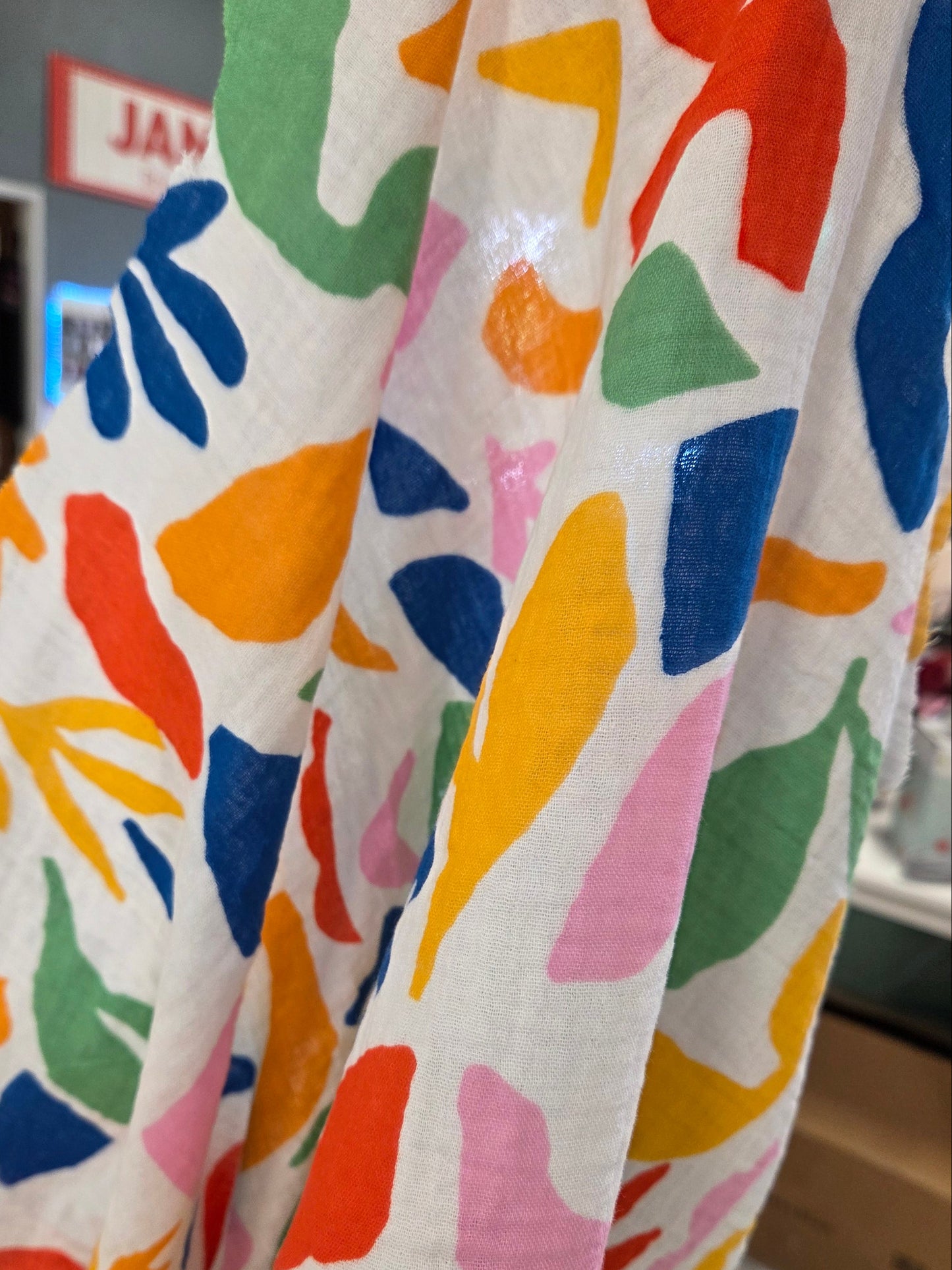 fabric held up against light, semi sheer cotton gauze woven by the yard